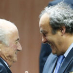 UEFA President Platini congratulates FIFA President Blatter after he was re-elected at the 65th FIFA Congress in Zurich